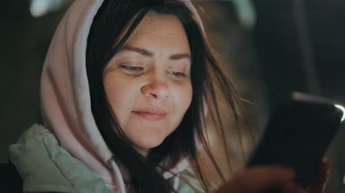 Closeup Smiling Young Tourist Woman Using Mobile Smart Phone in Night City