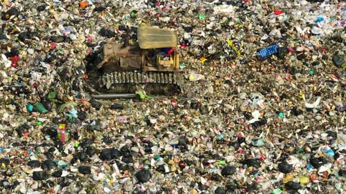 An aerial view over a landfill. 4K.