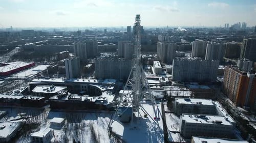Top view of big Ferris wheel in winter. Creative. Beautiful urban landscape with Ferris wheel