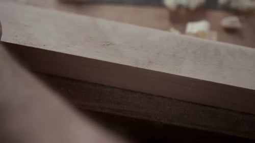 Close Up of Carpenter Smoothing Wood Block with Sandpaper 3539 Years