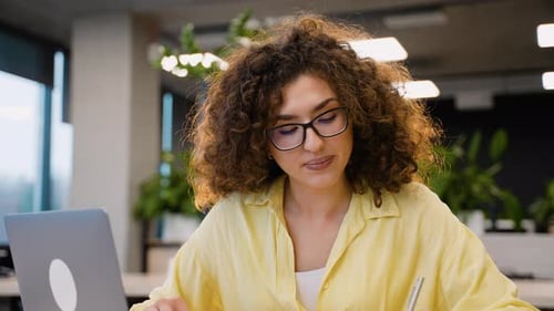 Female Student Studying Hard in University Classroom