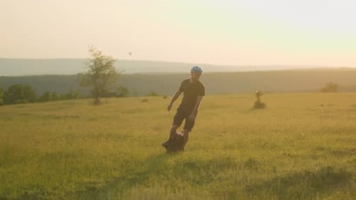 ChilledOut Guy Glides on an Electric Unicycle in Sunny Rural Summer Scene