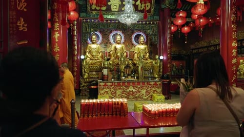 Chinese New Year People in Temple Praying Monk Performing Ceremony Statues of Deities Bangkok