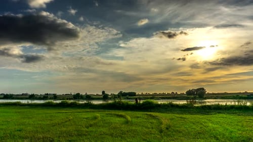 Clouds flowing in the sky at sunset over the Vistula river.