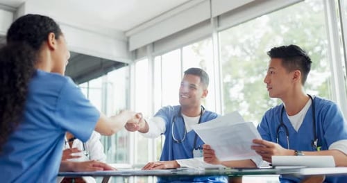 Medical Professionals Meet and Shake Hands