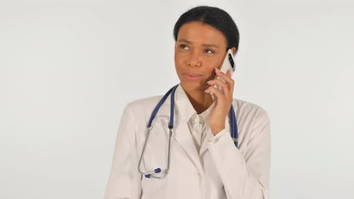 Woman Doctor Talking on Phone with Stethoscope