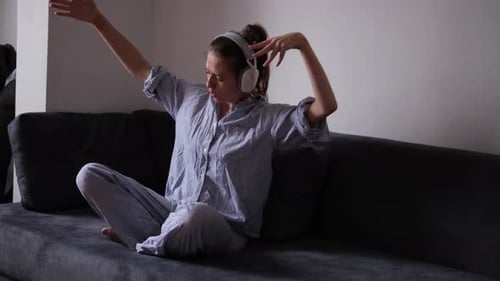 Woman Dancing and Singing Along with Headphones