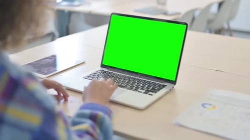 Close up of Young African Woman Using Laptop with Green Screen