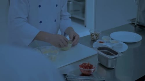 Chef Prepares Gourmet Dish in Professional Kitchen