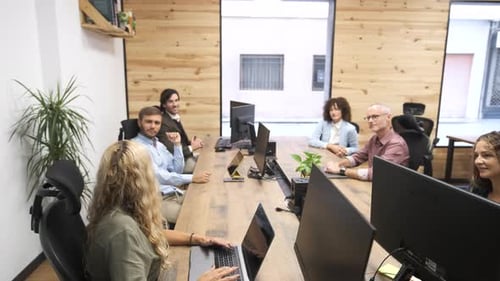 Group of Colleagues Working Together on Project in Office