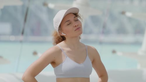 Woman Relaxing Outdoors in City Environment