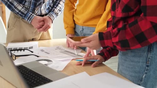 Group Examines Data in a Business Meeting