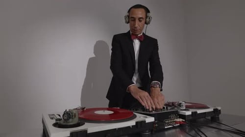 DJ Plays Music On Turntable Soundboard