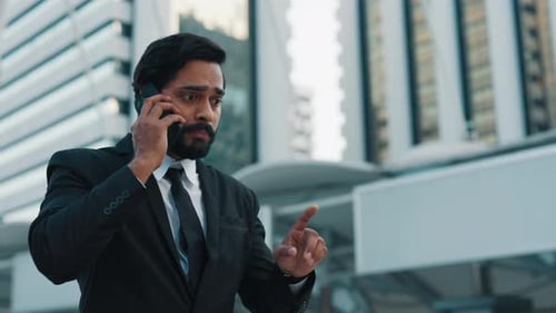 Stressed Boss Talking Strictly By Cellphone By Skyscrapers