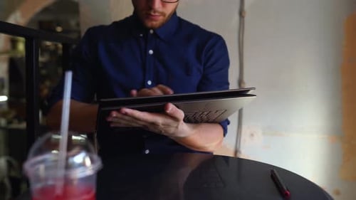 Freelancer Man Transforms Convertible Laptop to Tablet Mode and Works with Touchscreen Digital
