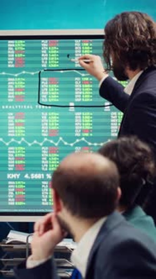 Sales Management Team Reviewing Global Stock Market Trends