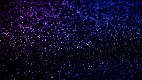 Glittering waves background with flowing vast field of shimmering purple and blue light particles