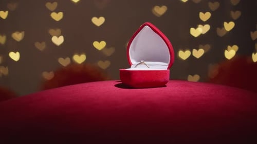 Wedding Ring in Heart Box with Bokeh Lights
