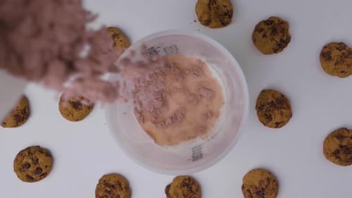 Cookies and Bowl Filling With Brown Powder