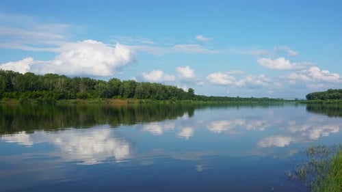 Calm River and Clouds Timelapse Pan View