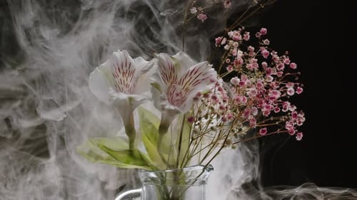 Floral Arrangement with Smoke in Glass Pitcher