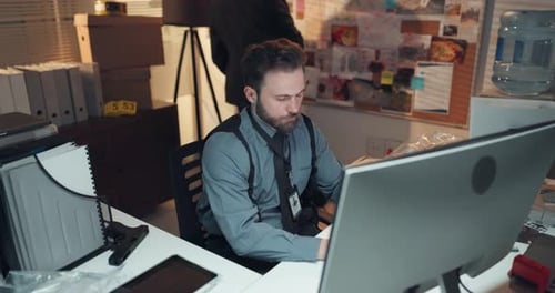 Computer, man and private investigator in office with typing for research on case with problem