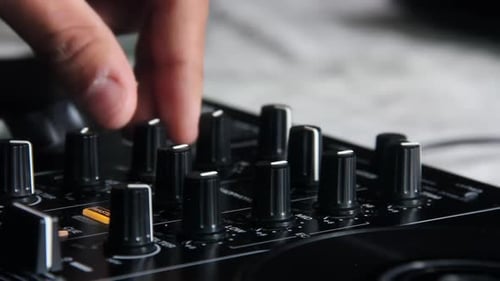DJ using Sound Mixing Deck. Close Up. 4K Resolution.