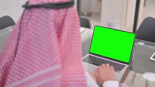 Arab Man Using Laptop with Green Screen