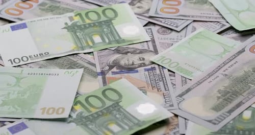 Cash USD and EURO Money Background One Hundred Dollar and Euro Banknotes Rotate in Close Up Macro