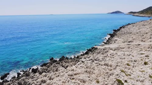 Shooting drone along sea and coast of islands on Mediterranean coast of Turkey.