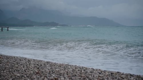 High Waves crashing onto the Pebble Beach, shaping the stones into perfect oval and smooth forms.