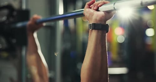Night, barbell and man in gym, hands and challenge with training, fitness and strong