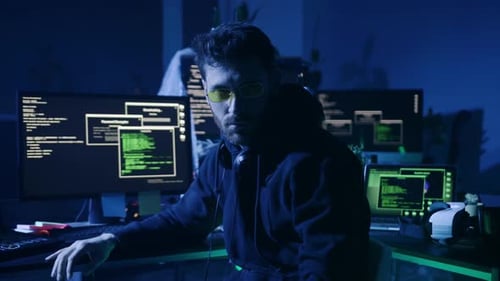 In a Mysterious Hightech Environment at Night a Hacker Engages in Complex Operations