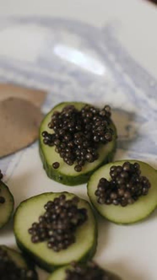 CloseUp of Caviar Appetizers on Cucumber Slices