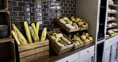 Delicious Assortment of Fresh Breads Displayed in a Warm Bakery Setting