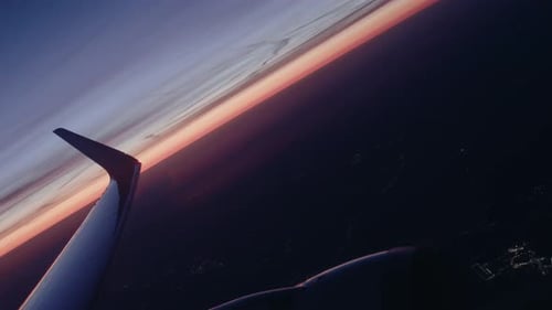 Airplane flying over city