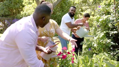 Friends Gardening Together in a Lush Backyard