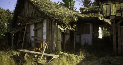 Rustic Abandoned Cottage in a Forest with Overgrown Thatch Roof