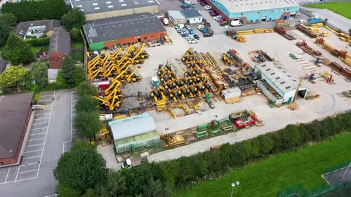 Aerial footage of the town of Morley in Leeds showing a building merchants in the town
