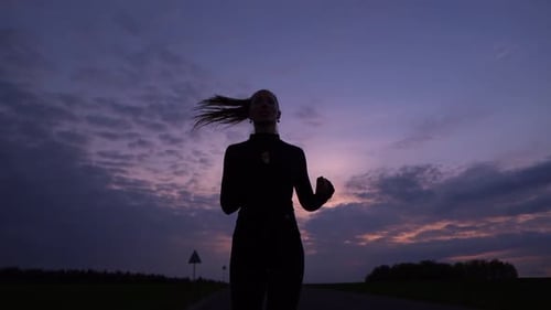 Runner Athlete Running on Road