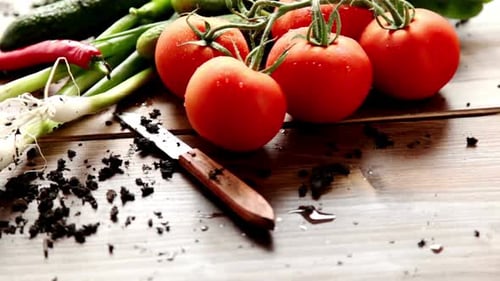 Fresh Vegetables on Wooden Table with Knife