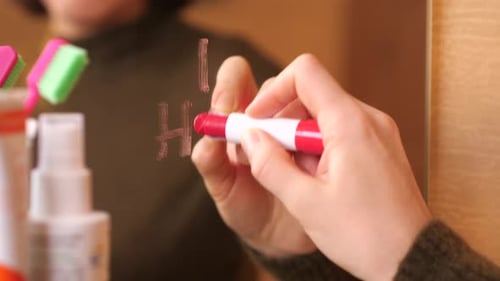 Woman Writes "I Hate You" on Mirror with Lipstick