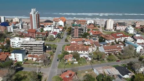 Aerial footage from the city with the ocean in the background