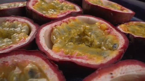 Juicy rotating passion fruits close up, tropical maracuya, tasty exotic fruit, 4K shot