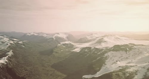 Majestic Mountain Landscape Bathed in Warm Sunlight During Twilight Hours