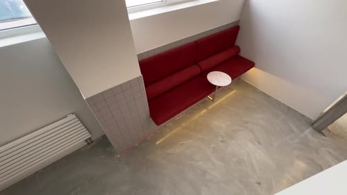 Red Seating and Table in Minimalist Cafe