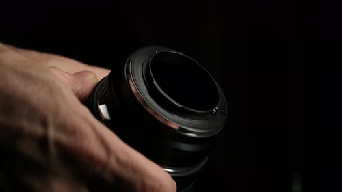Examining and Inspecting Camera Lens Bottom – Close Up Shot