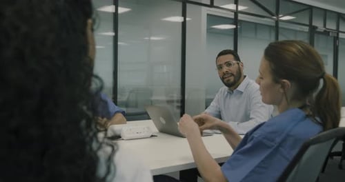 Healthcare Professionals in Meeting in Office