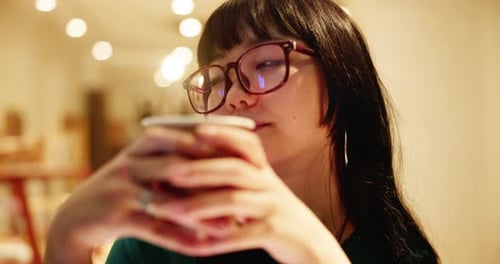 Asian woman, thinking and relax in cafe with coffee, break and window for peace in Japan