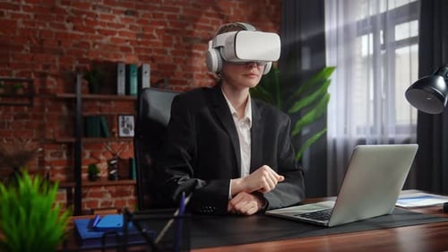Business Professional Using Virtual Reality Headset in Office